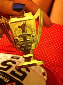 Close up of medal & my cute polka dot running skirt.